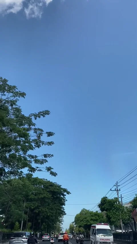 Suburban Tranquility: A Quiet Road Trip decorated with blue skies and few c.. Stock Footage 273839825