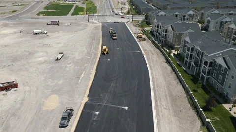 Suburban Utah roadwork development aerial view rising above new build real Stock Footage 245691675