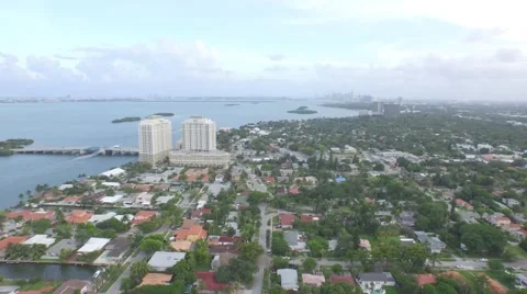 Suburban Waterfront Community Camera Motion from Skyline to Neighborhood Stock Footage 50137582