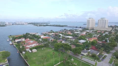 Suburban Waterfront Community Camera Motion from Skyline to Neighborhood Stock Footage 50137632