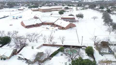 Suburbs Dallas school complex buildings show snow-dusted rooftops Stock Footage 327614337