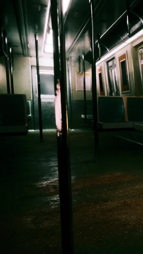 Subway interior view with empty seats and metal poles at night Stock Footage 341975590