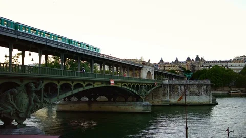 Subway metro train on bridge in Paris. Summer tourism &amp; romantic honeymoon Stock Footage 125112951