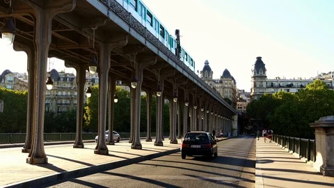 Subway metro train on bridge in Paris. Summer tourism &amp; romantic honeymoon Stock Footage 125113080