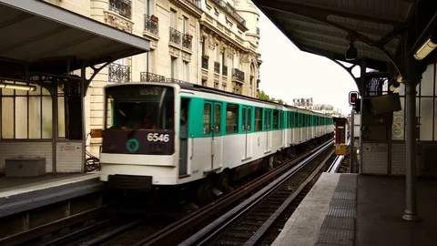 Subway metro train on bridge in Paris. Summer tourism &amp; romantic honeymoon Stock Footage 125113203