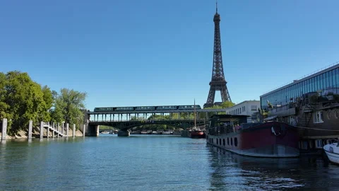 Subway passing on bridge by the Eiffel tower and the Seine river in Paris Stock Footage 316806870
