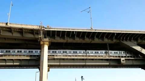 The subway is passing over the bridge. 스톡 동영상 145968870