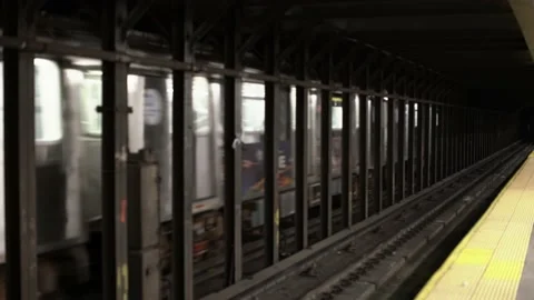 Subway passing station, Express MTA Subway train passing local station Stock Footage 199733316