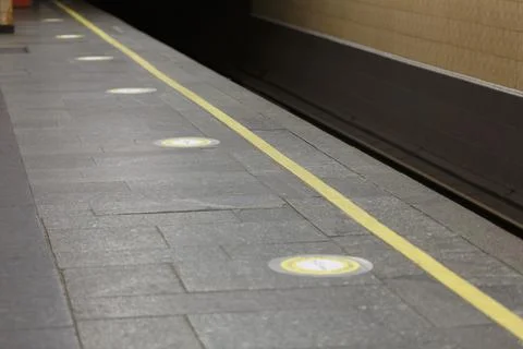 Subway platform with marking of a distance of one and a half meters for passe Fotos Stock