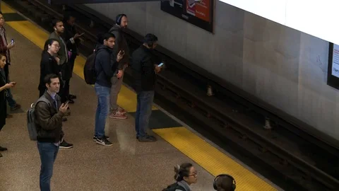 Subway pulls into station, passengers board Stock Footage 127457905