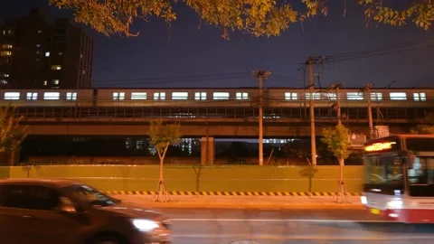 Subway running on the bridge at night Stock Footage 218292394
