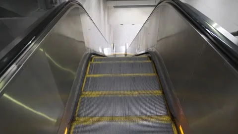 Subway station escalator moving up. Top view. Big city underground metro Stock Footage 252863555
