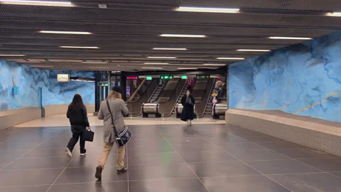 Subway station hall and escalators with people in Stadion station, Stockholm Stock Footage 340274797