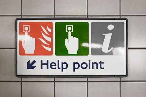 Subway station help point sign with fire alarm, emergency call button and Stock Photos