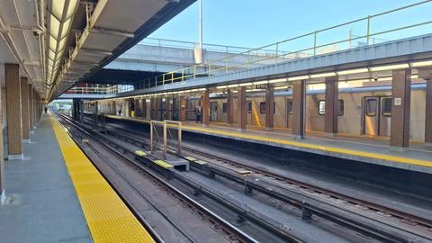 Subway station platform with train tracks in the city Stock Photos