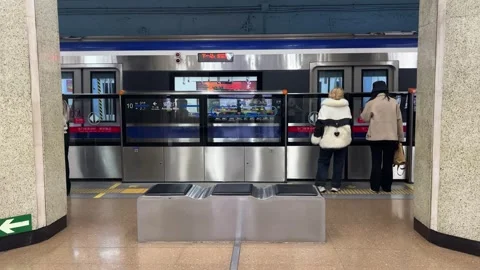 Subway Station Platform with Two People Waiting, Urban Transit Background Stock Footage 331208212
