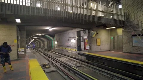 Subway Train Approaching De La Savane Station Platform in Montreal Stock Footage 329942103