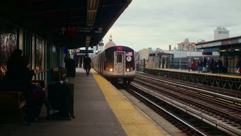 Subway Train Approaching an Elevated New York Platform Stock Footage 348090289