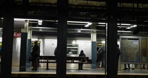 Subway Train approaching Subway station in NYC. Passengers getting on train Stock Footage 219405520