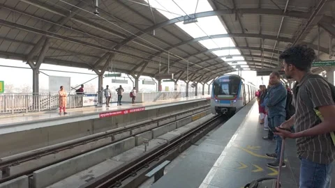 The subway train arrives at the platform of the metro station in Hyderabad Stock Footage 310775060