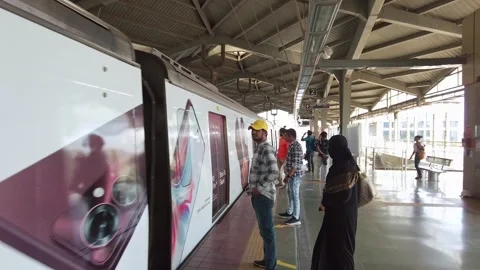 A subway train arrives at platform of metro station Stock Footage 313214345