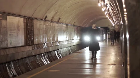 The subway train arrives at the platform. People waiting for the train at the pl Stock Footage 196121349