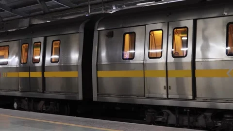 The subway train arrives at the platform of Rapid Metro in Gurugram, India Stock Footage 295369352