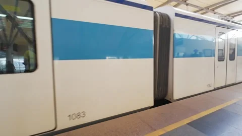 Subway train arrives at the platform of Rapid Metro station Stock Footage 314675305