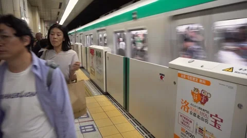 Subway Train Arriving and Commuters Exiting in Kyoto, Japan Stock Footage 264985386