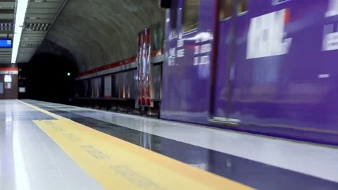 Subway train arriving to the underground platform station in Helsinki with Stockbeeldmateriaal 73810698