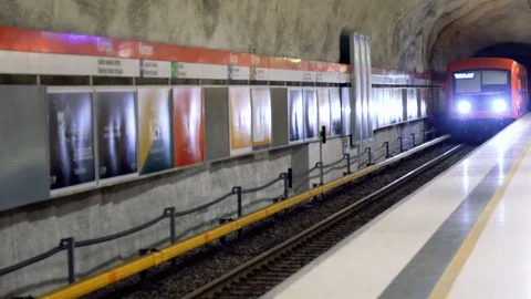Subway train arriving to the underground platform station in Helsinki with Stock Footage 73823629
