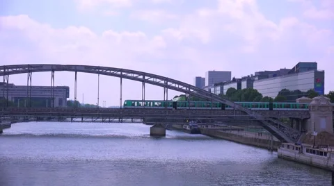 A subway train crosses a bridge over the Seine in Paris. Stock Footage 41579686