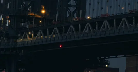 Subway train Crosses over the Manhattan Bridge at Night. Stock Footage 166592632