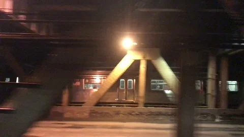 Subway train crossing the bridge at night time Stock Footage 71300645