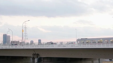 Subway train crossing bridge into Osaka city Umeda station panning shot 스톡 동영상 72578840