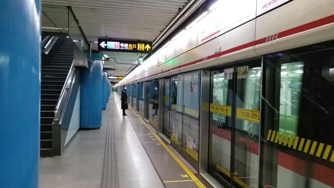 Subway Train Departs From Empty Station in China Stock Footage 124677813