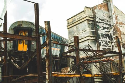 Subway train derailment into a building while falling off of the tracks Stock Photos