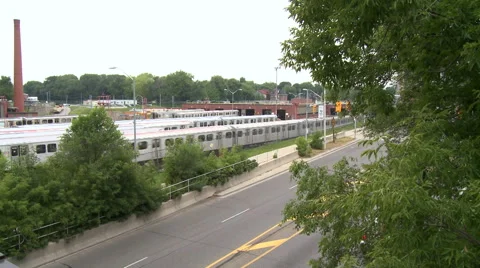 Subway train drives on tracks, parallel to highway Stock Footage 41673667