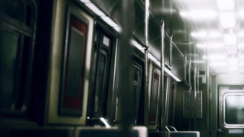 Subway train interior with empty seats and dim lighting during commute time Stock Footage 339878183
