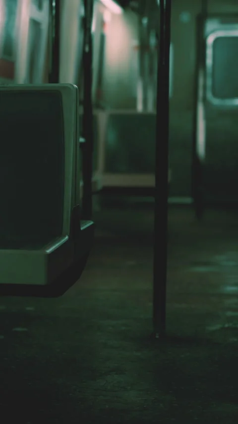 Subway train interior showing seats and poles in a quiet setting Stock Footage 340642484