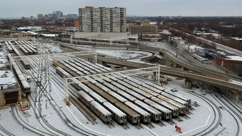 Subway train making a loop in snow covered train yard Stock Footage 101746140