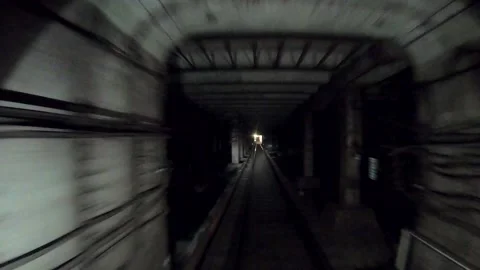 Subway train moving fast at dark tunnel. Speed underground train ride in tunnel Stock Footage 302888250