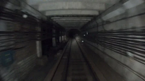 Subway train moving fast at dark tunnel. Underground train riding in tunnel Stock Footage 321346397