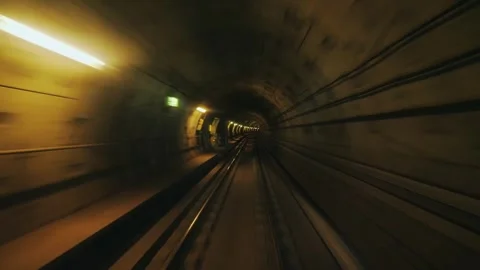 Subway train moving fast through dark underground tunnel with flashing lights Stock Footage 334984620