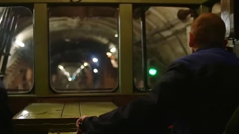 A subway train operator is driving the train Stock Footage 83691872