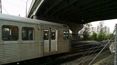 Subway train pass under bridge with danger sign. Stock Footage