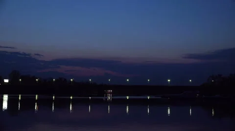 Subway Train Passes Over the Bridge Under the River at the Evening Sunset Stock Footage 49626898