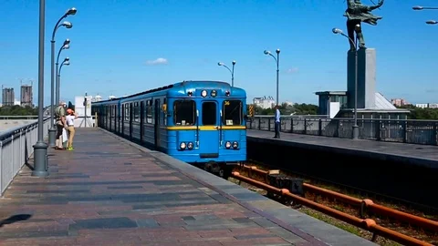 A subway train passes a station underground Stock Footage 79708667