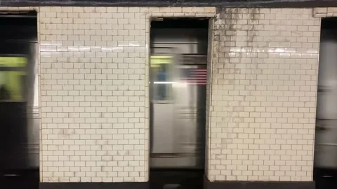 Subway Train Passing by in Station in Brooklyn, New York City (NYC) Stock Footage 228690545