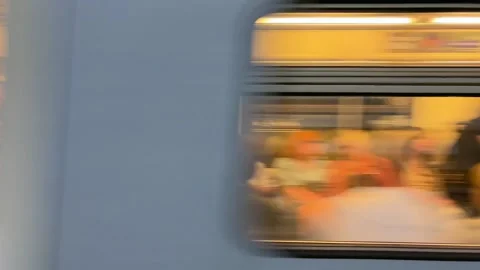 Subway train with people inside moving fast from metro station, close up Stock Footage 276991783